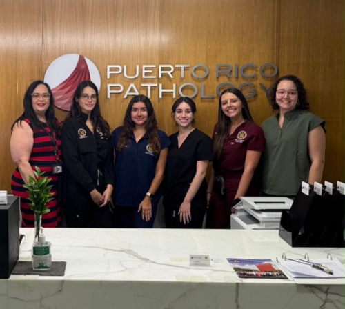 Dr. Kaylee Boschetti-Santana with mentor Dr. Elba Torres-Matundan and fellow medical students.